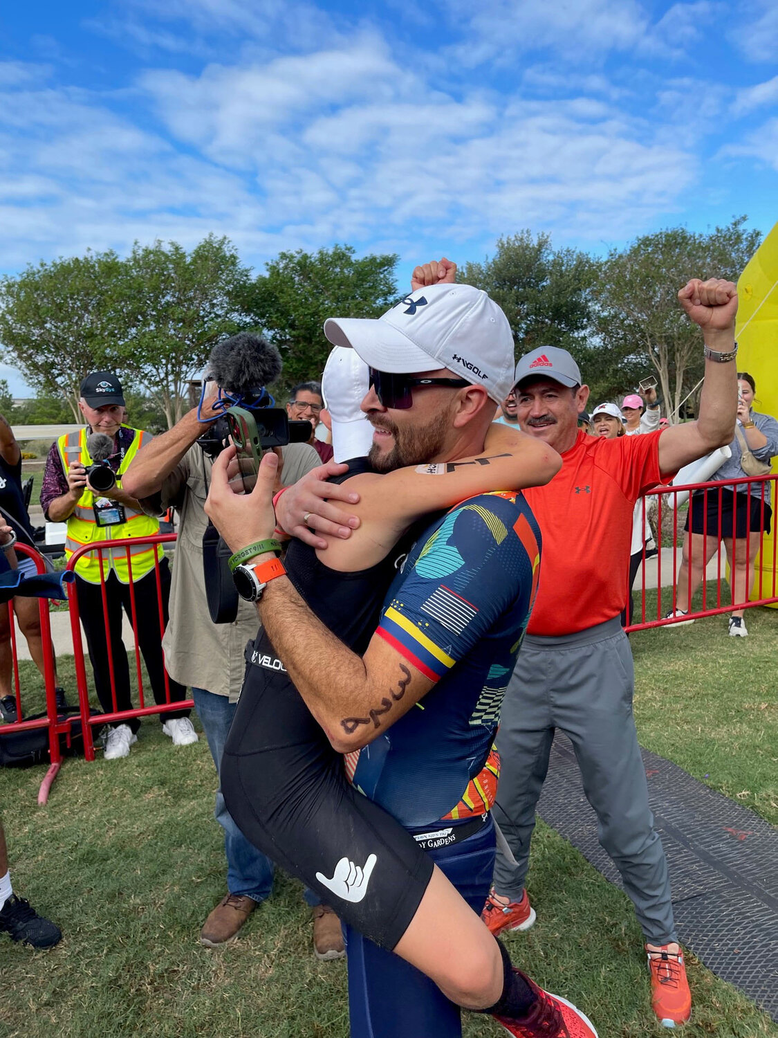 After completing the triathlon, Nico is embraced by his father, Christian Reyes.